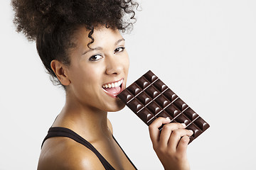 Image showing Woman eating chcolate