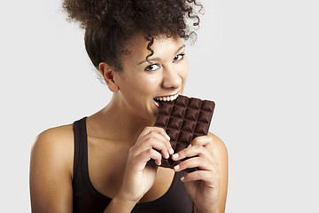 Image showing Woman eating chcolate