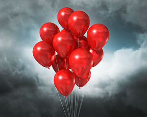 Image showing red balloons on a cloudy dramatic sky