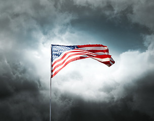 Image showing American flag on a cloudy dramatic sky