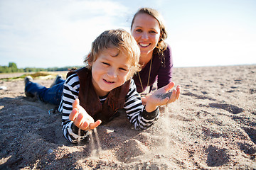 Image showing Mother and son at beach.