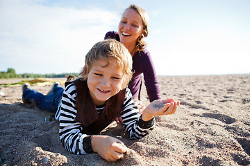 Image showing Mother and son at beach.