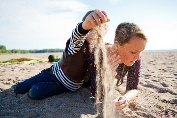 Image showing Mother and son at beach.