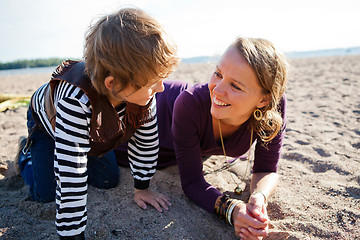 Image showing Mother and son at beach.