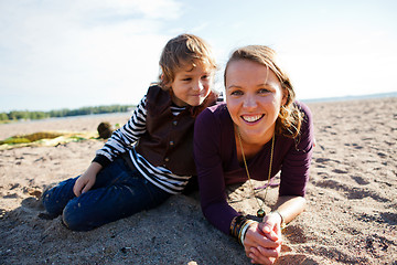 Image showing Mother and son at beach.