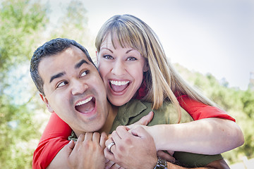 Image showing Attractive Mixed Race Couple Piggyback at the Park