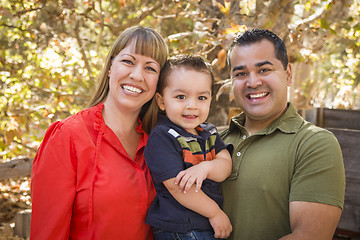 Image showing Happy Mixed Race Family Posing for A Portrait