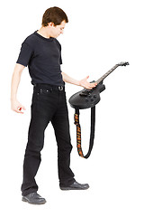 Image showing Virtuoso guitarist, dressed in black