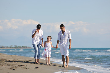 Image showing happy young  family have fun on beach