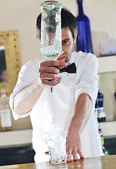 Image showing pro barman prepare coctail drink on party