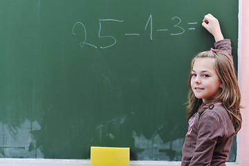 Image showing happy school girl on math classes