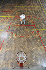 Image showing businessman holding basketball ball