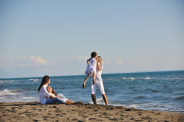 Image showing happy young  family have fun on beach