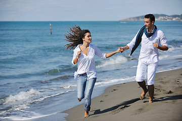 Image showing happy young couple have fun at beautiful beach