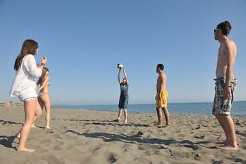 Image showing young people group have fun and play beach volleyball