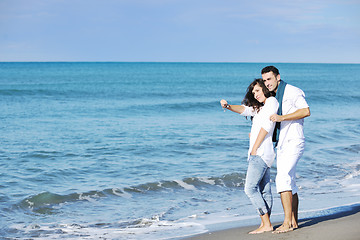 Image showing happy young couple have fun at beautiful beach