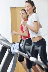 Image showing woman workout  in fitness club on running track 