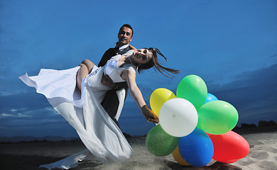 Image showing romantic beach wedding at sunset