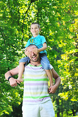 Image showing happy father and son have fun at park