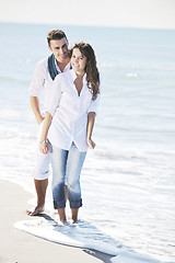 Image showing happy young couple have fun at beautiful beach