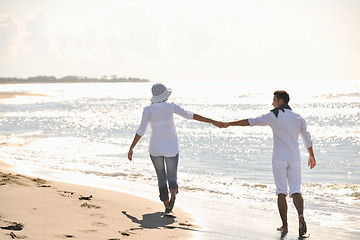 Image showing happy young couple have fun at beautiful beach