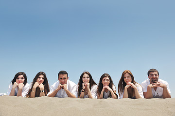 Image showing Group of happy young people in have fun at beach