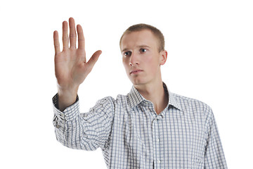 Image showing handsome young business man touching screen isolated