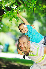 Image showing happy father and son have fun at park