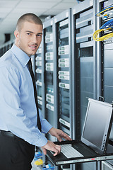 Image showing young it engeneer in datacenter server room