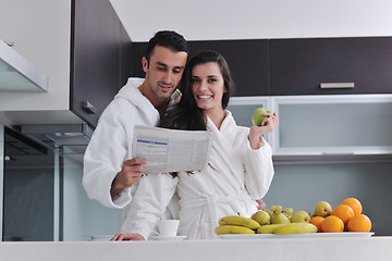 Image showing young couple have fun in modern kitchen