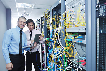 Image showing it engineers in network server room