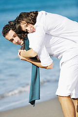 Image showing happy young couple have fun at beautiful beach