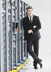 Image showing young it engeneer in datacenter server room