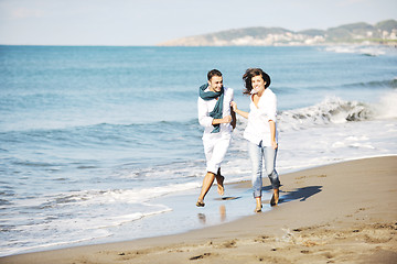 Image showing happy young couple have fun at beautiful beach