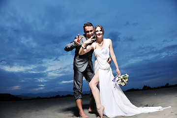 Image showing romantic beach wedding at sunset