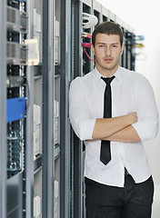 Image showing young it engeneer in datacenter server room