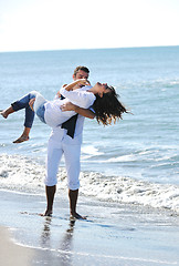 Image showing happy young couple have fun at beautiful beach