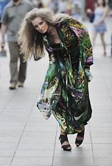 Image showing elegant woman on city street at night