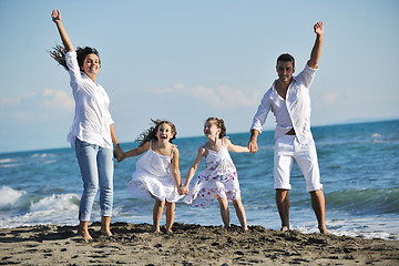 Image showing happy young  family have fun on beach