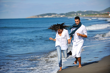 Image showing happy young couple have fun at beautiful beach