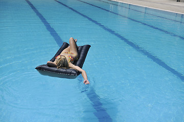 Image showing beautiful woman relax on swimming pool