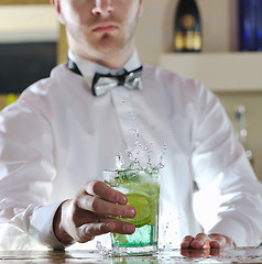 Image showing pro barman prepare coctail drink on party