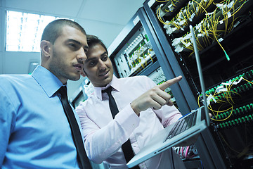 Image showing it engineers in network server room