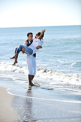 Image showing happy young couple have fun at beautiful beach