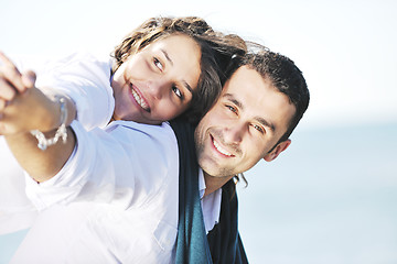 Image showing happy young couple have fun at beautiful beach