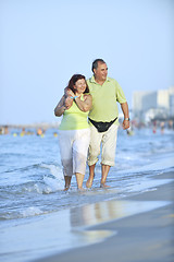 Image showing happy seniors couple  on beach