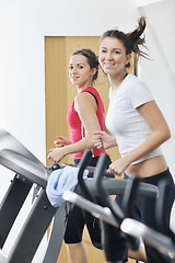 Image showing woman workout  in fitness club on running track 