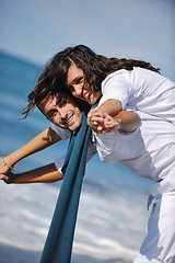 Image showing happy young couple have fun at beautiful beach