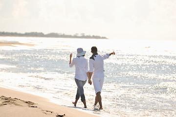 Image showing happy young couple have fun at beautiful beach