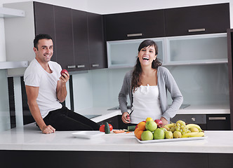 Image showing young couple have fun in modern kitchen